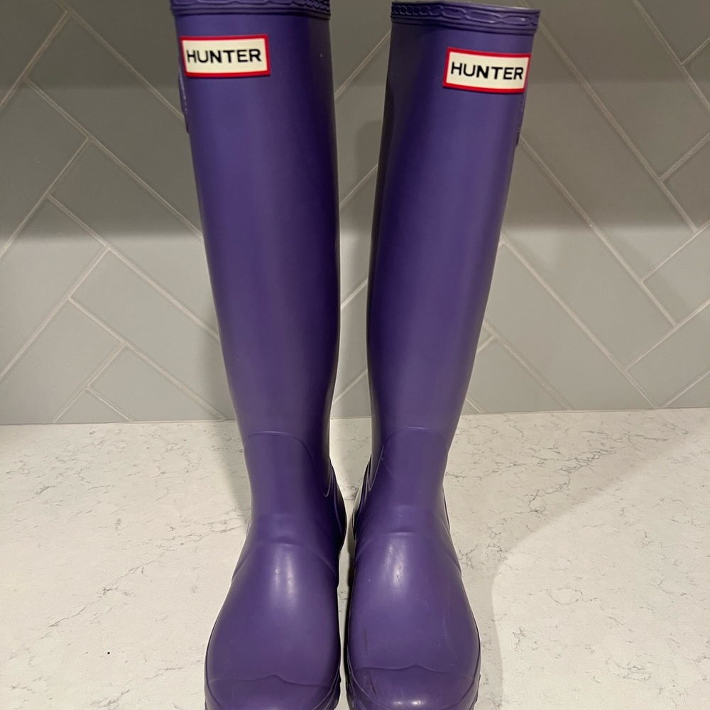 Gently used purple tall Hunter rain boots. Size 7.